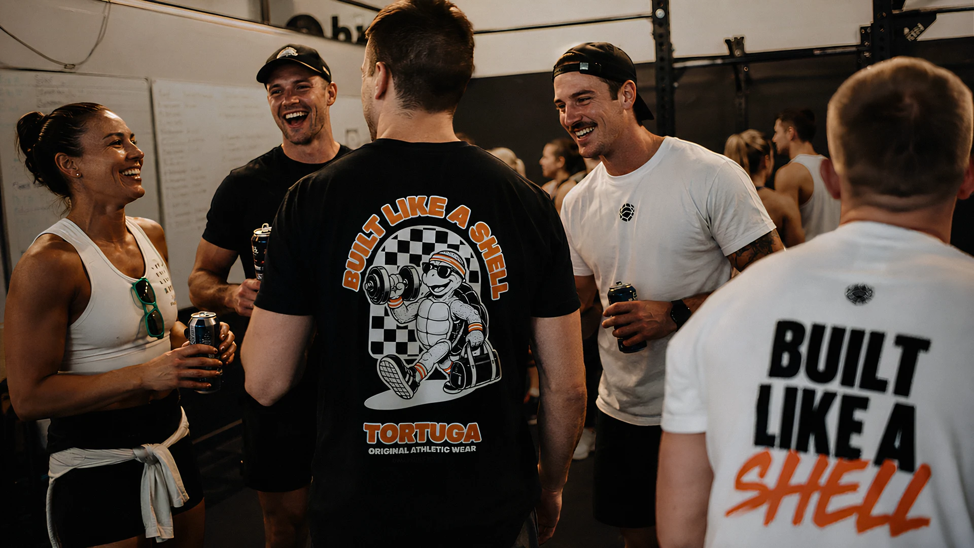Tortuga members in "Built Like a Shell" T-shirts talking after training